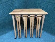 A teak nest of five tables