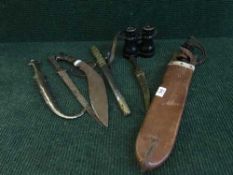 A kukri, a machete in sheath, a Japanese style dagger,