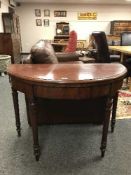 A nineteenth century mahogany d-shaped card table