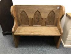 A reclaimed pine Gothic style bench