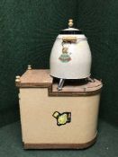 An enamel coated Roaster Master on stand