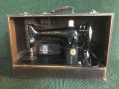 A Singer sewing machine in case