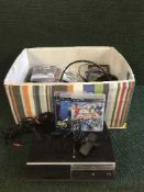 A box of Playstation 3 with games and accessories