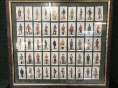 A collection of pictures, framed cigarette cards etc.