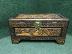 A heavily carved Oriental hardwood blanket box