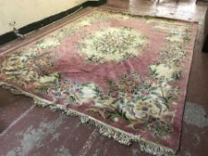 A large pink fringed carpet