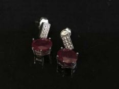 A pair of silver and African ruby drop earrings