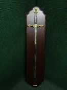A large ornamental sword on wooden board - Excaliber