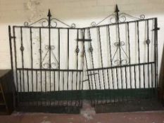 A pair of wrought iron garden gates