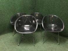 Four contemporary perspex seated chairs
