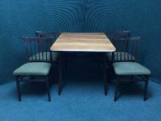 A teak topped dining table and four chairs