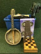 Two boxes of halogen lights, games, camping seat,