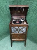 A gramophone in cabinet and a quantity of 78's