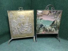 A brass fire screen and mirrored fire screen