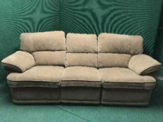 A contemporary three seater reclining settee
