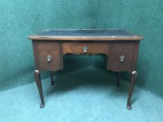 A mahogany leather topped desk
