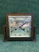 An oak Art Deco mantel clock