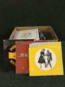 A box of records and box of cds and dvds