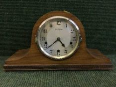 A mahogany mantel clock