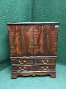 An inlaid mahogany TV cabinet