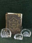 A Victorian leather bound family bible and three glass paperweights