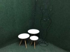 A contemporary hat and coat stand and three graduated stools