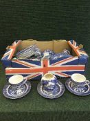 Two boxes of blue and white Willow pattern dinner ware,