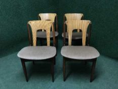 A set of four teak chairs
