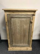 A reclaimed pine single door cupboard