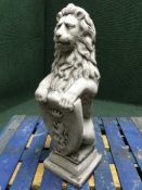 A garden figure - lion holding a shield