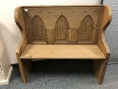 A reclaimed pine Gothic style bench