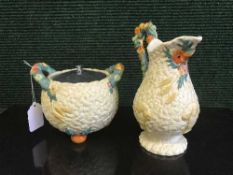 A Clarice Cliff Newport pottery jug and twin handled pot