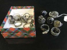 A collection of silver dress rings