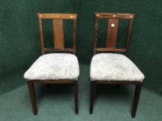 Four Victorian inlaid mahogany dining chairs