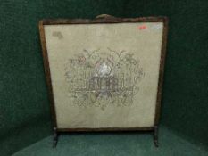 A large oak tapestry fire screen with silver thread depicting the Taj Mahal