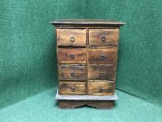 A contemporary hardwood eight drawer chest