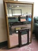 A pine framed mirror and a mahogany framed mirror
