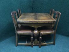 A pull out oak dining table and six chairs