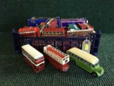A crate of die cast double decker buses