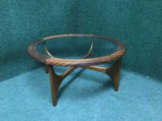 A 1970's teak glass coffee table
