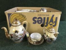 An EPNS scalloped edged tray, three piece Walker & Hall tea service, plated cruet set,