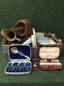 A box of cutlery sets, brass ware,