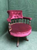 An oak and velvet upholstered chair