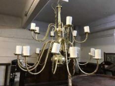 A brass eighteen arm chandelier