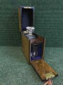 A Victorian burr walnut and ebonised decanter box with decanter and key by Samuel Fisher,