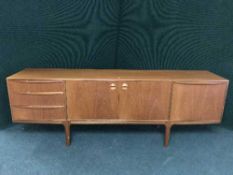 A mid 20th century teak long John sideboard