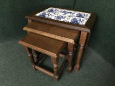 A nest of three Dutch oak tiled top tables