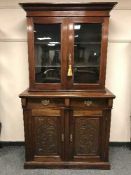 A Victorian mahogany bookcase fitted with two cupboards below