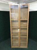 A pair of glazed door bookcases
