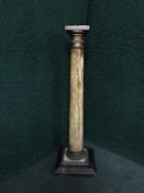 An ormolu mounted alabaster torchere